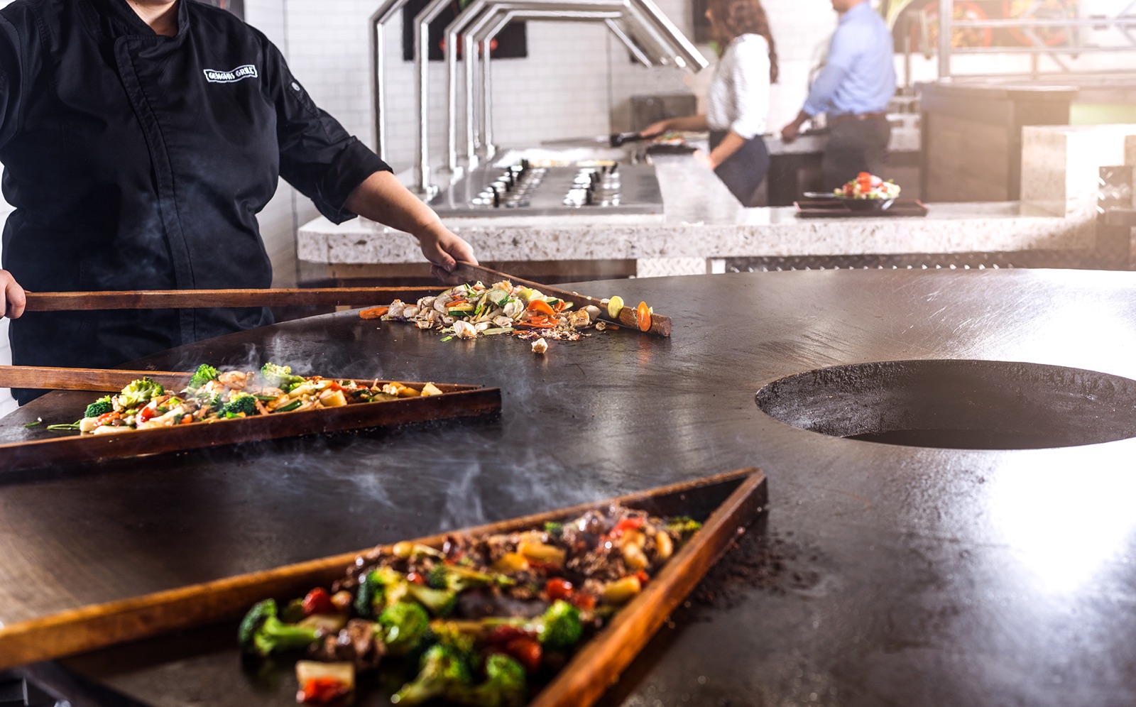 Genghis Grill interior with the signature round flat-top grill.